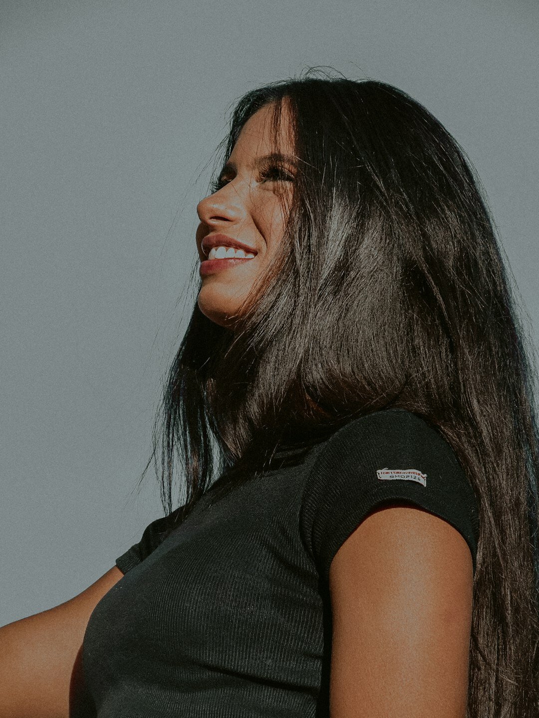 Slovenian woman with long dark hair smiling gently
