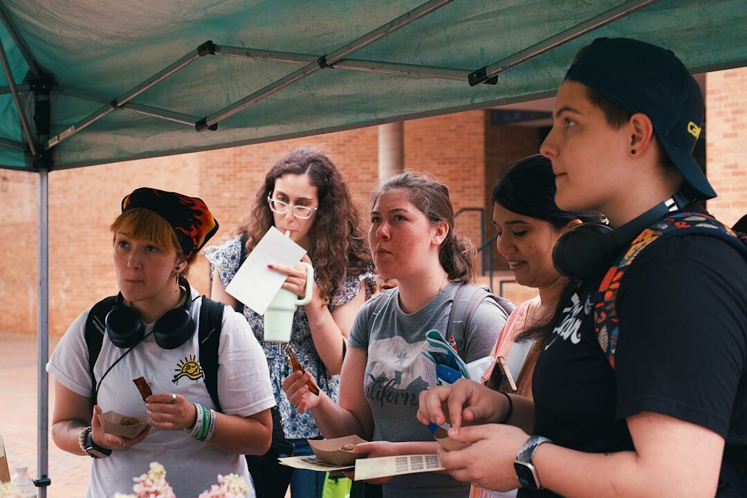 Small group of trainers discussing notes around a table