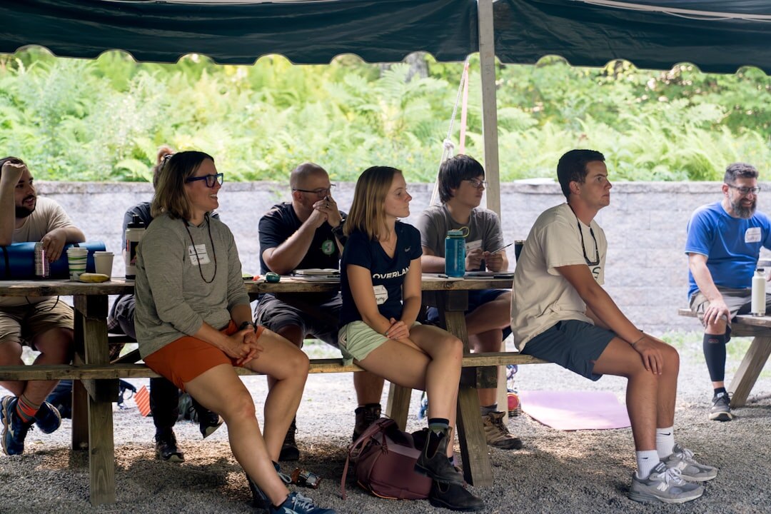 Group of people rehearsing a panel discussion at a table
